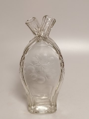 Double hunting bottle decorated with olive grinds
