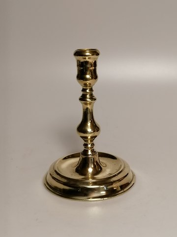 Next candlestick of brass stamped