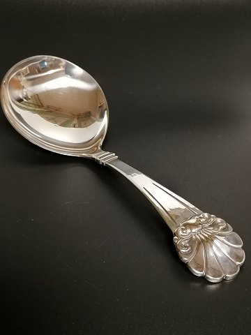 Large serving spoon of three-tower silver